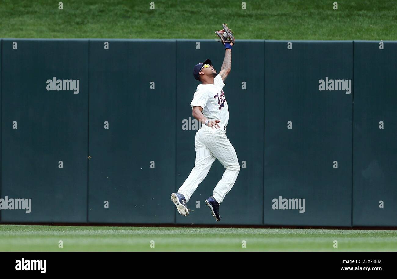 Minnesota Twins center fielder Byron Buxton makes a diving catch near  second baseman Brian Dozier (2) on a ball hit by Kansas City Royals' Jorge  Bonifacio in the sixth inning during the