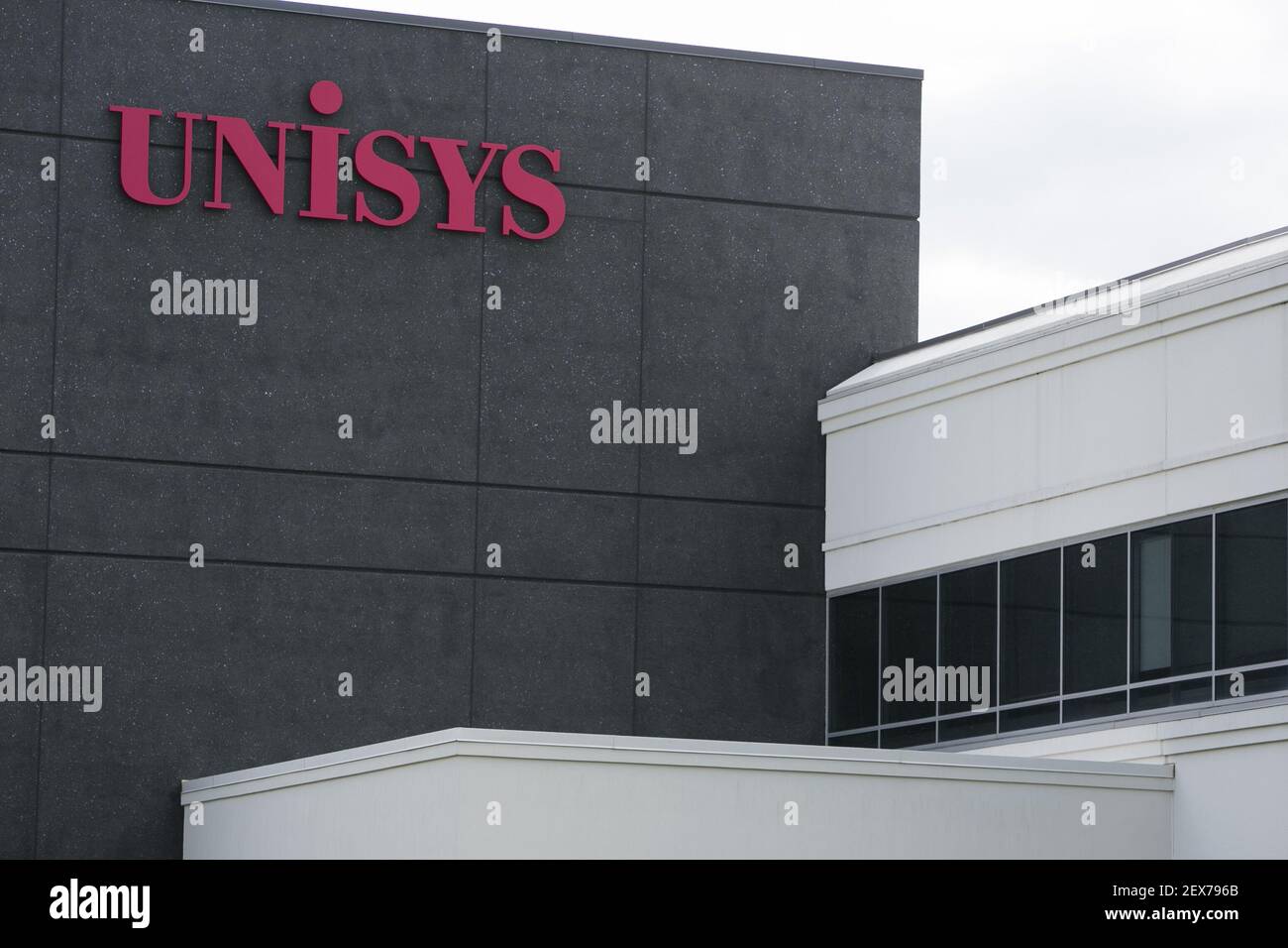 A logo sign outside of the headquarters of Unisys Corporation in Blue