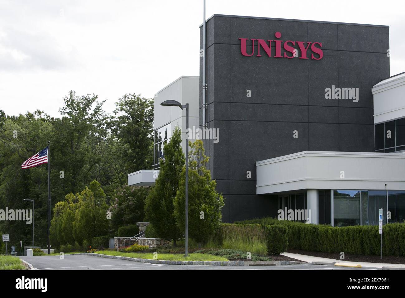 A logo sign outside of the headquarters of Unisys Corporation in Blue