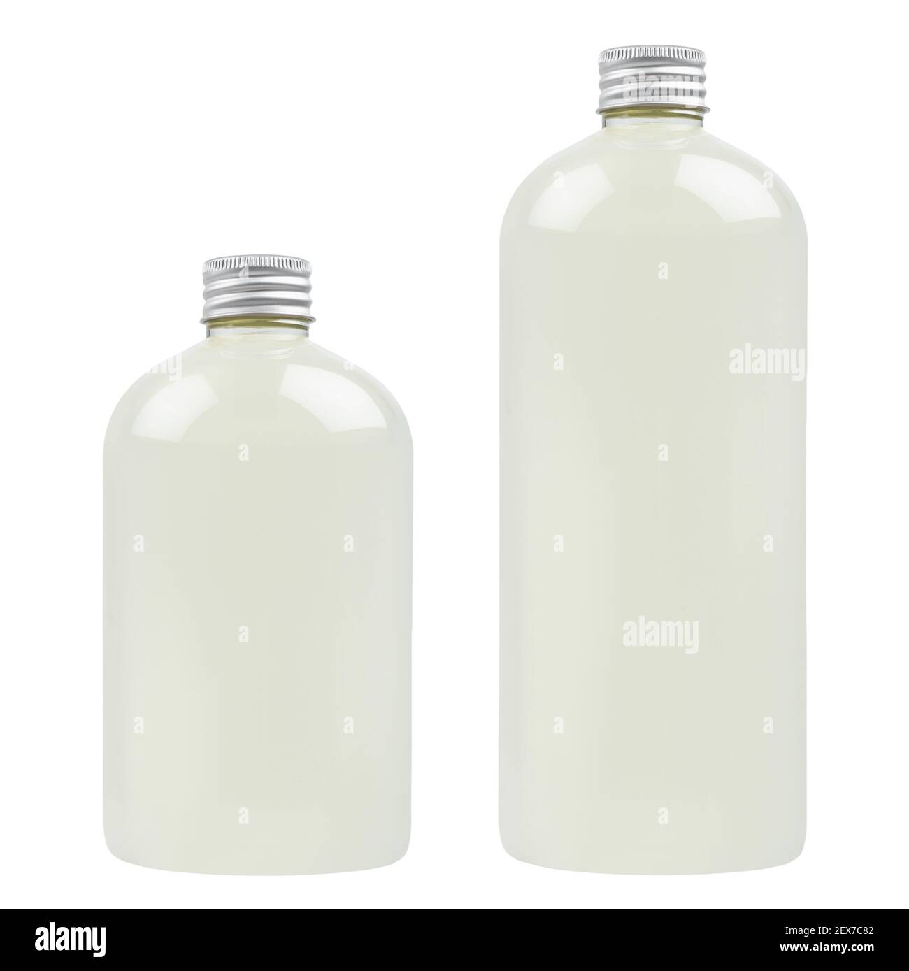 Set of two plastic tall and low bottles with pale fresh drink or cosmetic essential oil, silver cap mockup, isolated, template. Stock Photo