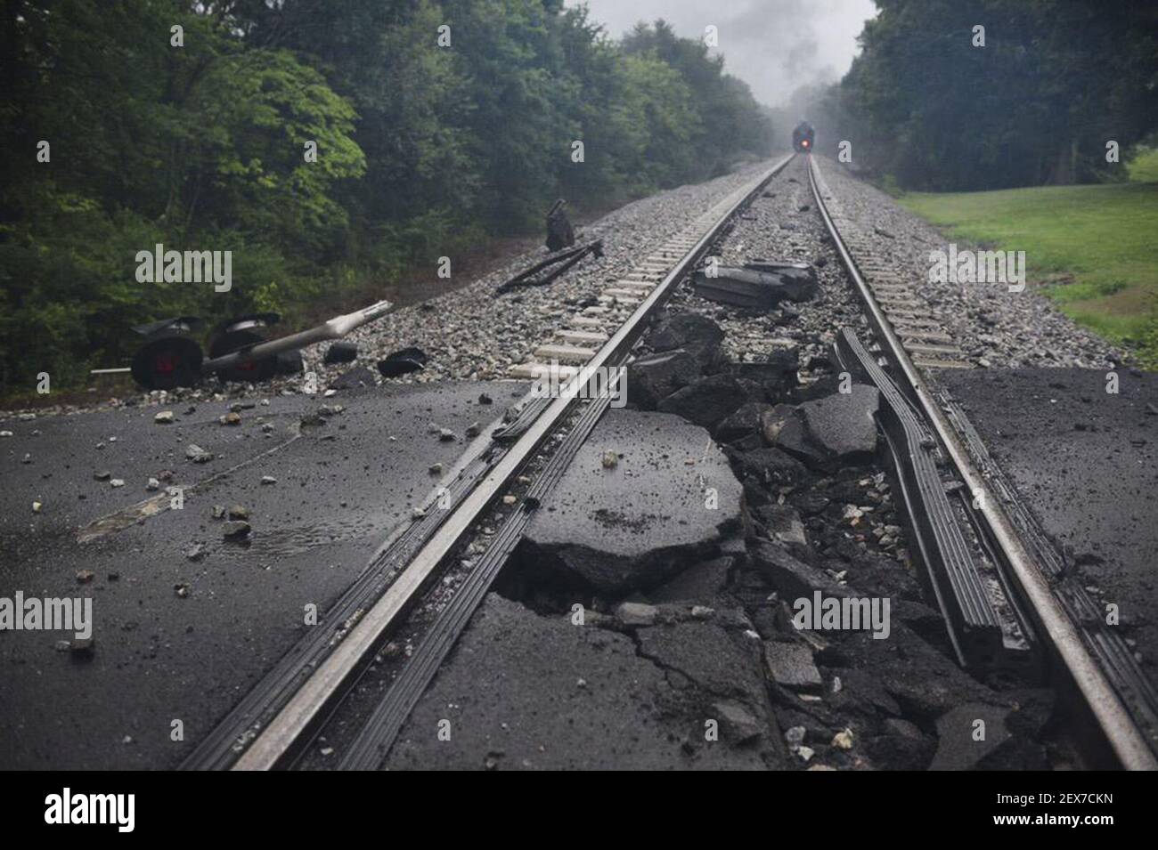 A damaged rail bed is seen near a CSX train following the derailment of a tank car carrying a 'highly flammable and toxic' gas on Thursday, July 2, 2015, in Maryville, Tenn. The single tank car loaded with acrylonitrile, a hazardous material used in a variety of industrial processes including the manufacture of plastics, forced an evacuation of residences and businesses in a two-mile radius. (Photo by Michael Patrick/Knoxville News Sentinel/TNS) *** Please Use Credit from Credit Field *** Stock Photo