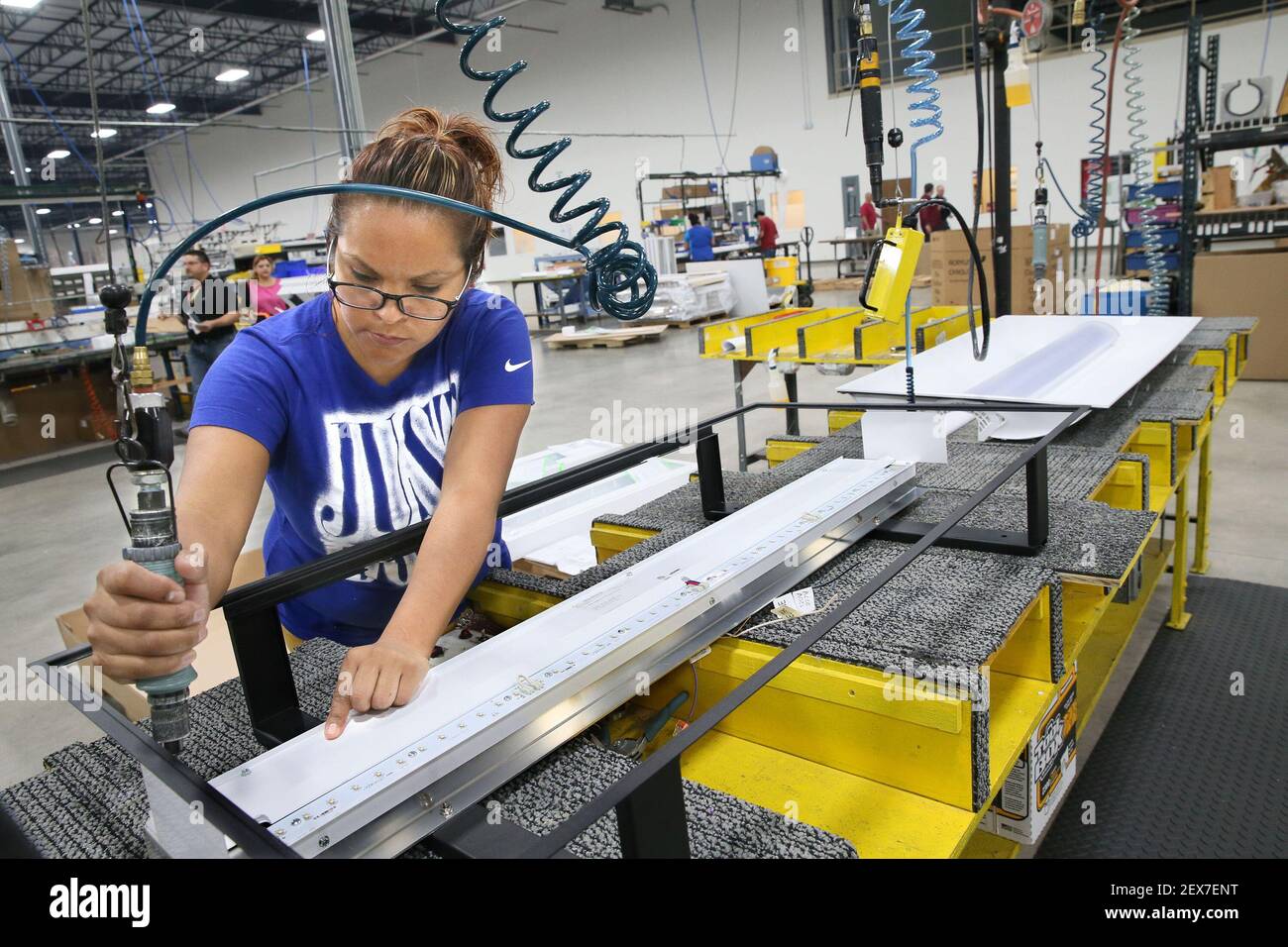 Reyes builds one of the IndigoClean fixtures on June 23, 2015 at