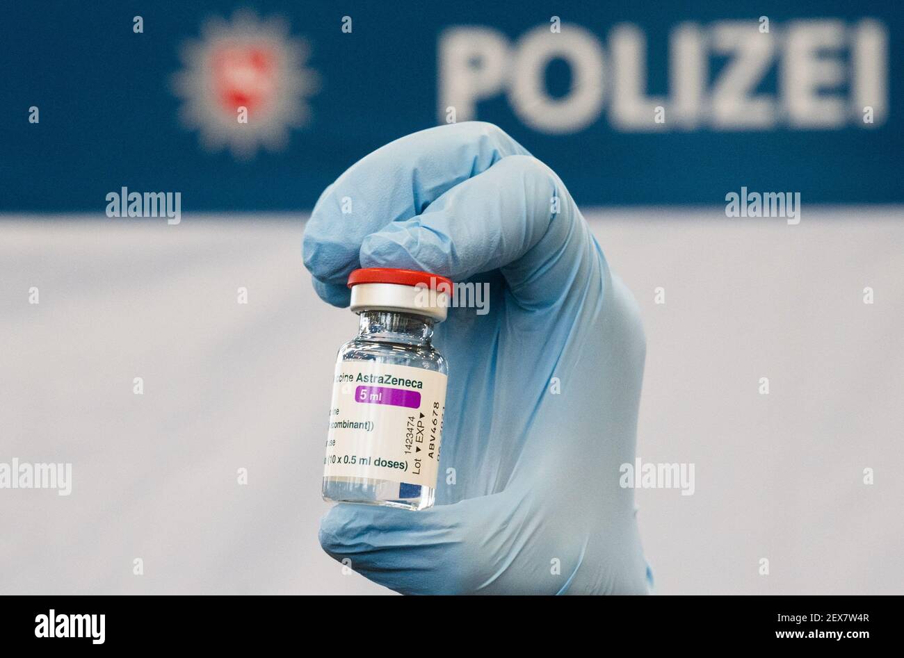 04 March 2021, Lower Saxony, Hanover: A doctor shows a vial of AstraZeneca vaccine at the Lower Saxony Central Police Directorate. Prioritized vaccination of police officers has begun in Lower Saxony. Photo: Julian Stratenschulte/dpa Stock Photo