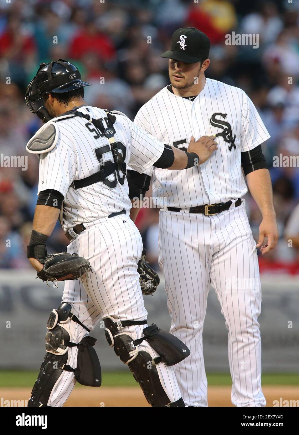 Chicago White Sox catcher Geovany Soto (58) taps pitcher Carlos Rodon on  the chest after Rodon gives up a two-run single to the St. Louis Cardinals'  Yadier Molina in the third inning