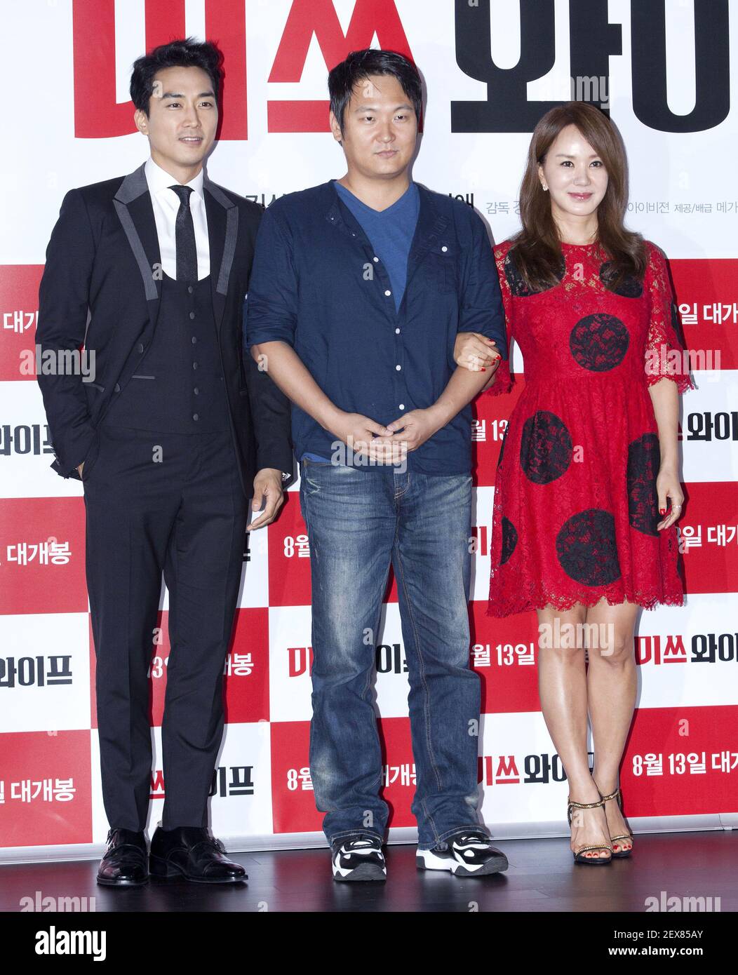 28 July 2015 - Seoul, South Korea : (L to R)) South Korean actor Song Seung- Heon, director Kang Hyo-Jin and actress Uhm Jung-Hwa, attend a photo call  for the new film â€œMiss