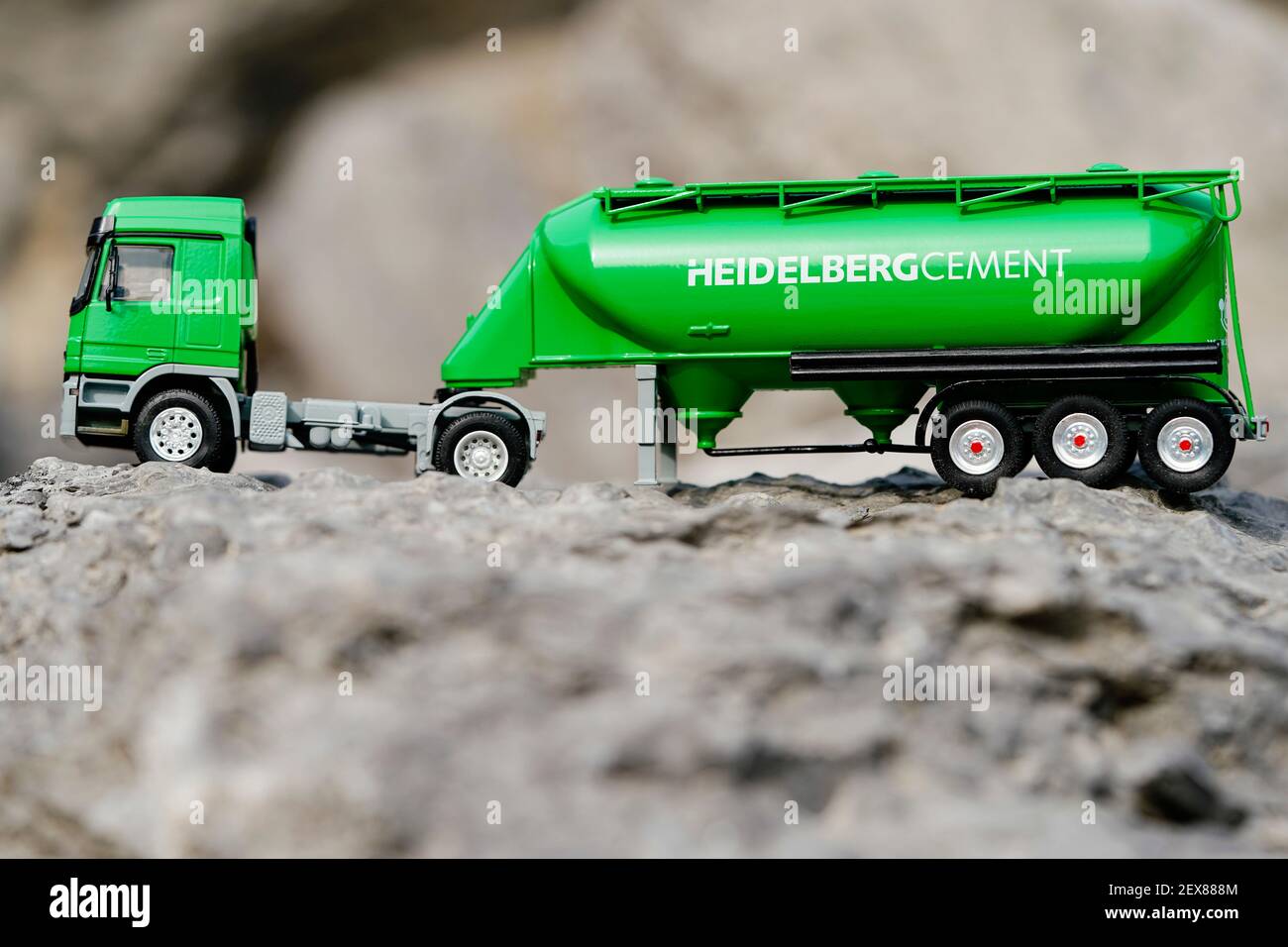 ILLUSTRATION - 03 March 2021, Baden-Wuerttemberg, Nußloch: The model of a cement truck stands on demolition material in the quarry of the HeidelbergCement building materials group. Photo: Uwe Anspach/dpa Stock Photo