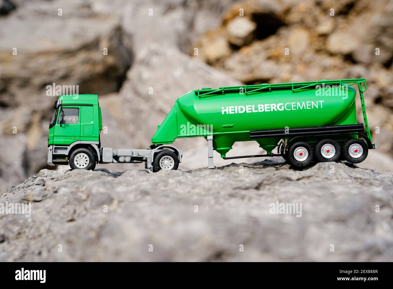 ILLUSTRATION - 03 March 2021, Baden-Wuerttemberg, Nußloch: The model of a cement truck stands on demolition material in the quarry of the HeidelbergCement building materials group. Photo: Uwe Anspach/dpa Stock Photo