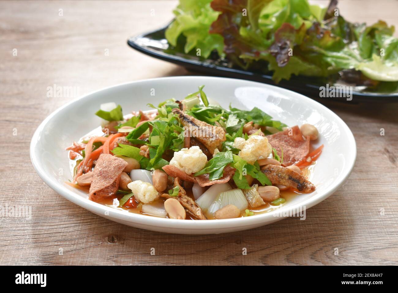 crispy fish with pork couple maw topping peanut in spicy and sour chili