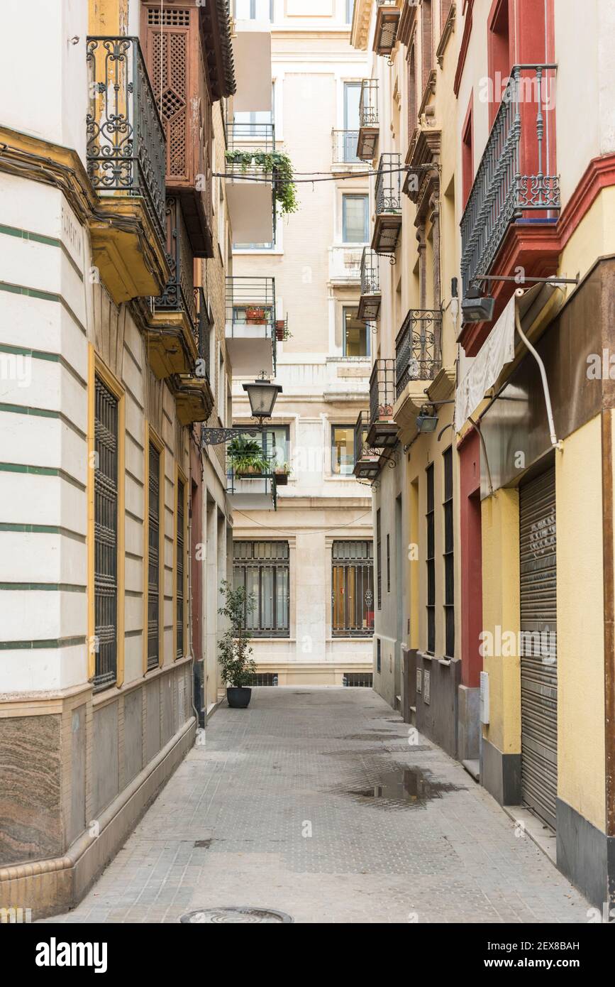 An empty narrow street showing the buildings in the city centre of ...