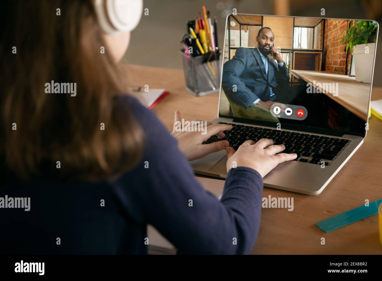 Video Call Lesson Little girl studying by group video call, use video conference with ...