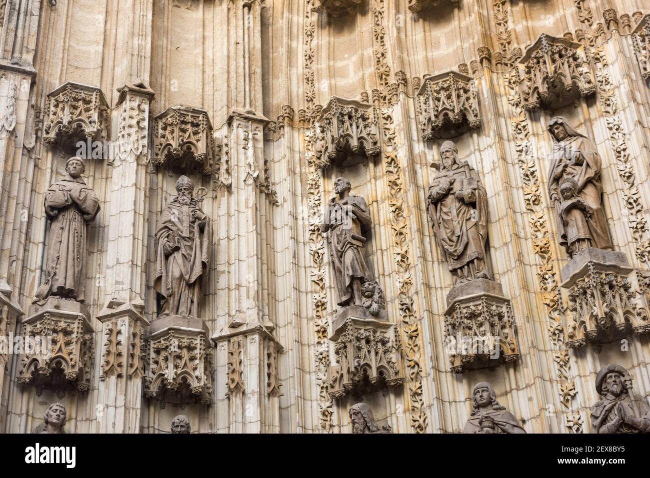 Stone statues on the walls at the Seville cathedral in Seville Spain