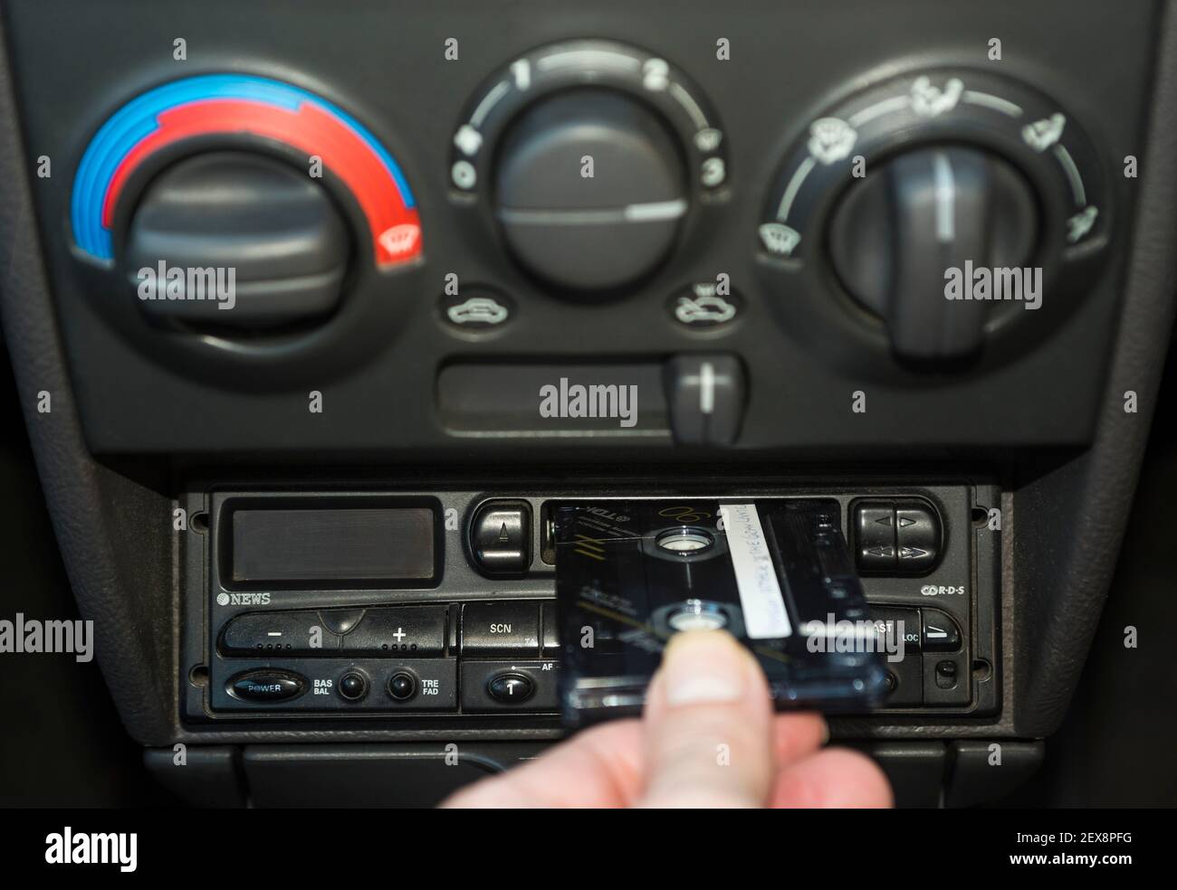 Old, car cassette radios stacked on top of each other on the shelves in car  service Stock Photo - Alamy