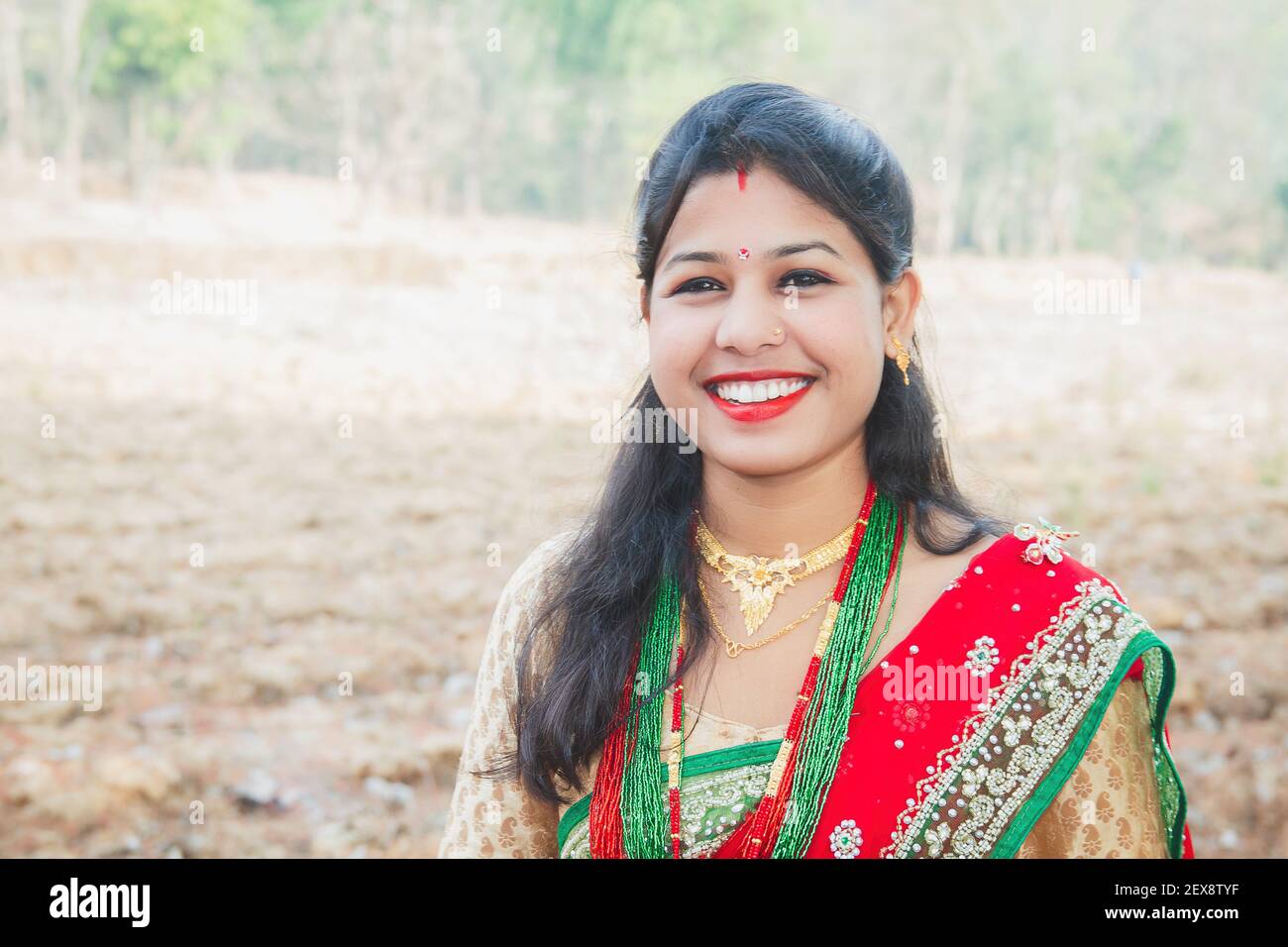 Beautiful Asian Indian Nepali Bride Wearing Ethnic Traditional Outfit With Gold Jewellery And