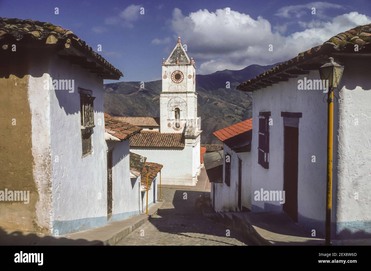 PUEBLO NUEVO, MERIDA STATE, VENEZUELA - Steep street and church in traditional colonial village in Andes. Stock Photo