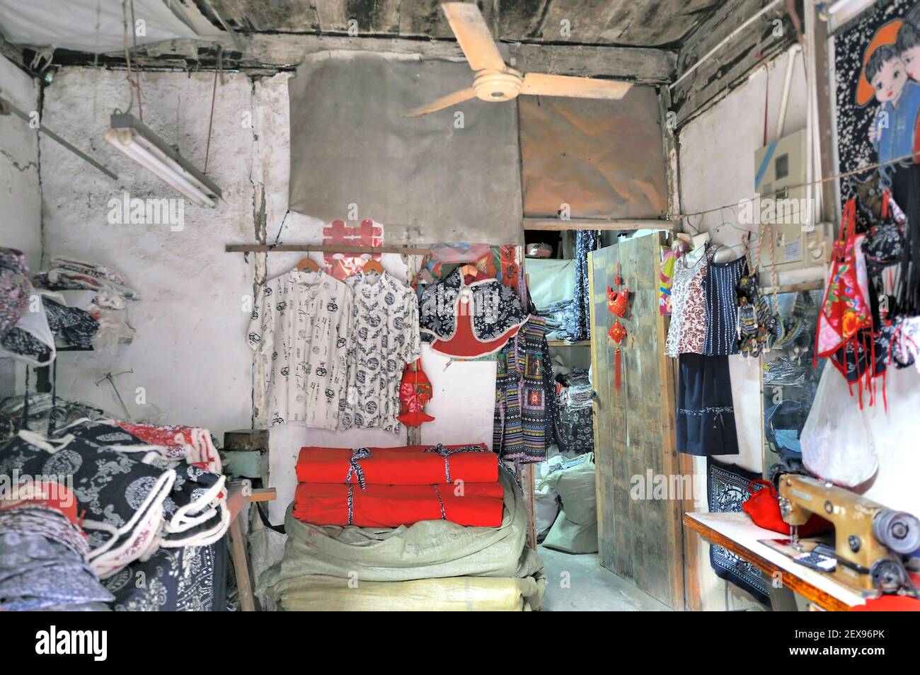 WUZHEN, CHINA-NOVEMBER 26, 2008: Illegal clothing factory in China while the workers have a break Stock Photo