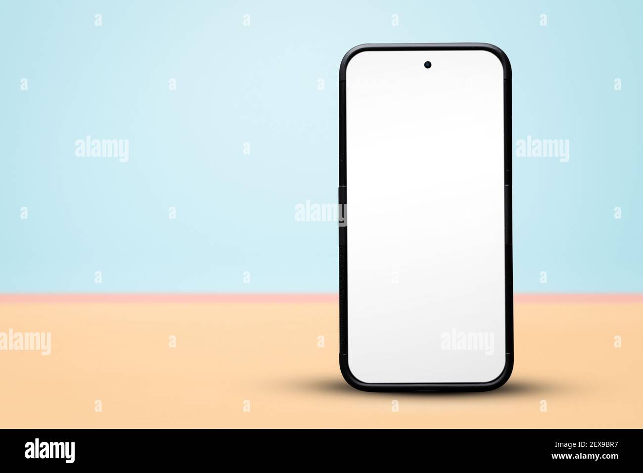 Blank smartphone standing on a pastel background with copy space Stock Photo