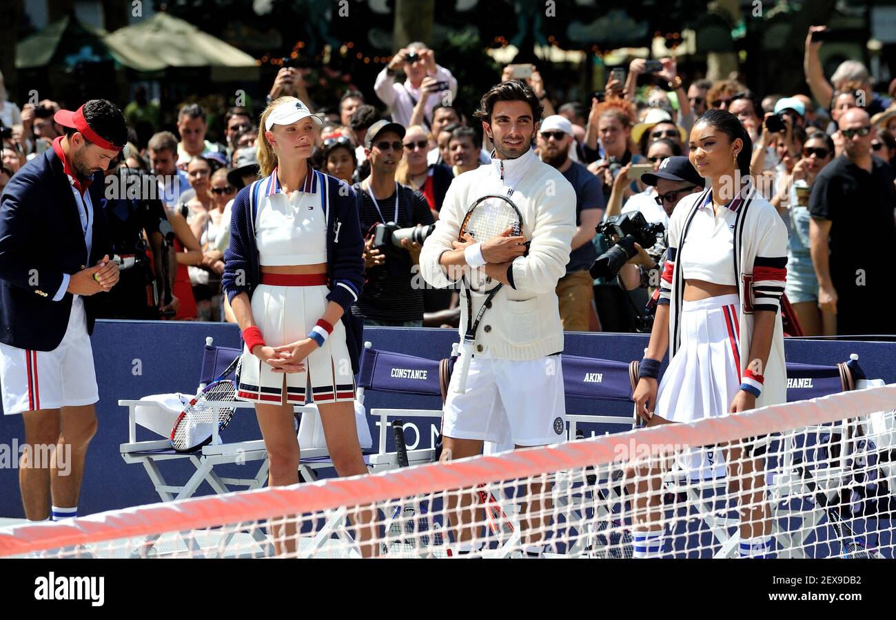 Models Noah Mills, Constance Jablonski, Akin Akmna and Chanel Iman  courtside at the Tommy Hilfiger "TommyXNadal" celebrity tennis event in  Bryant Park in New York, NY on August 25, 2015. (Photo by