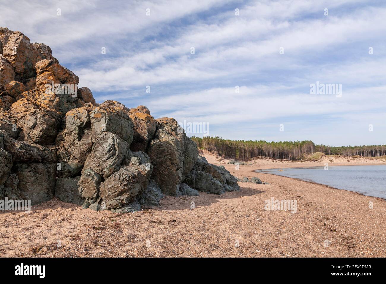 Volcanic rock outcrop at Llanddwyn Island, Newborough Beach, Anglesey, North Wales Stock Photo