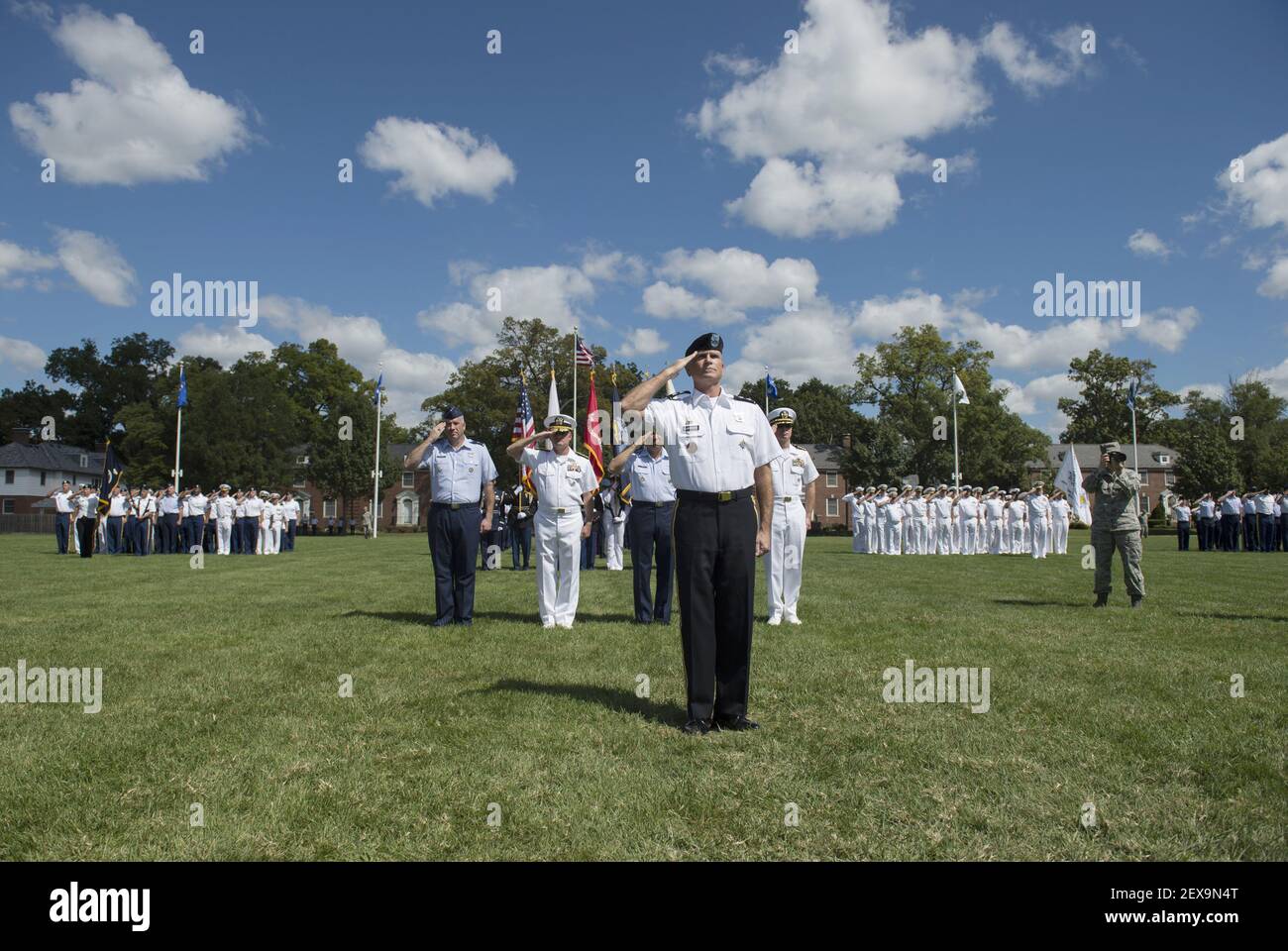 Service members from the U.S. Transportation Command stand in formation ...