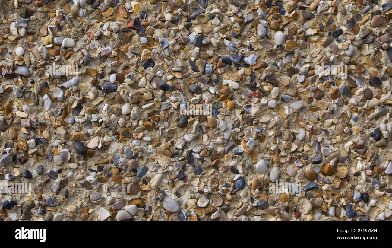 Full frame background of pebble dashed wall with space for copy Stock Photo