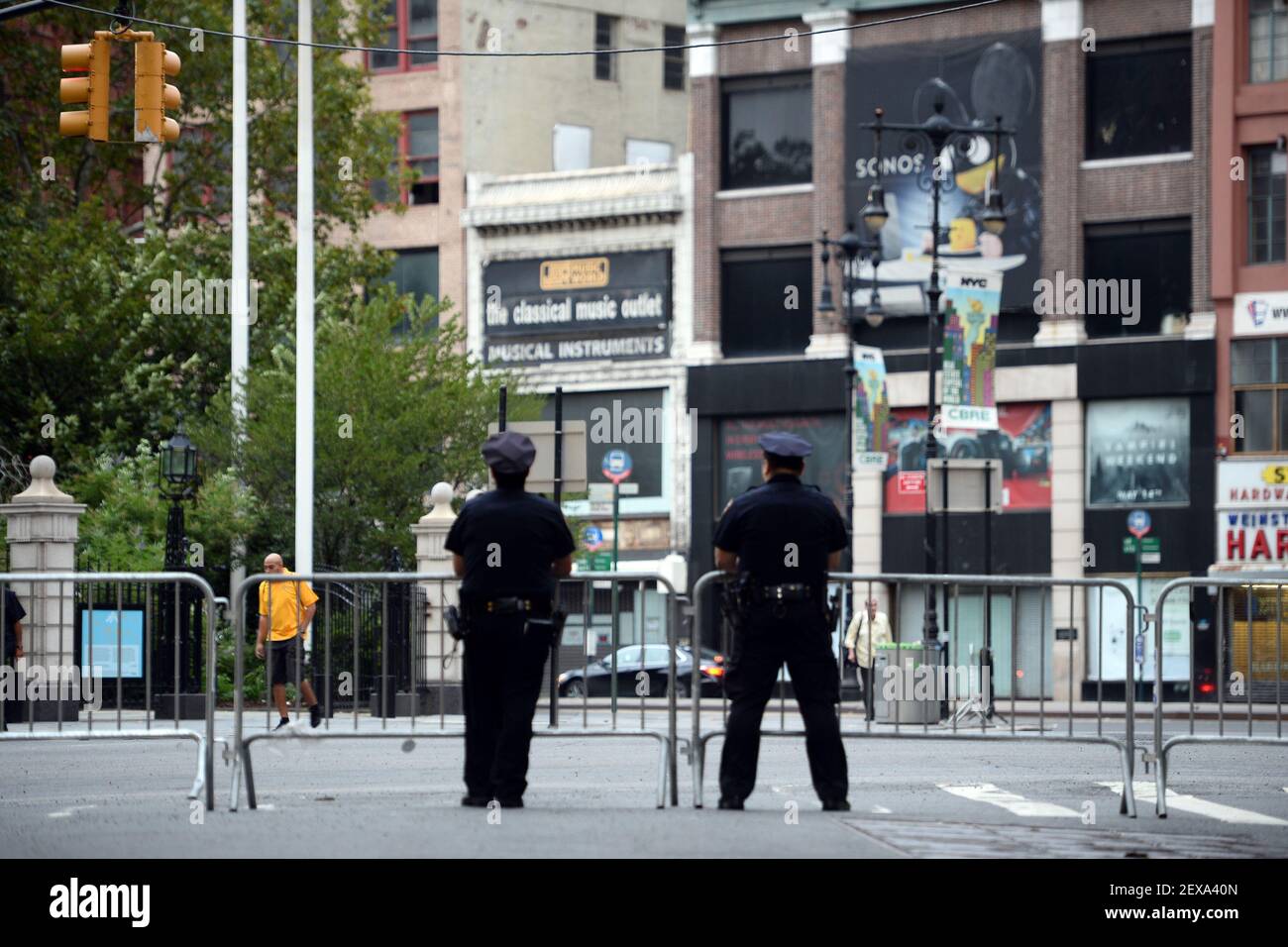 Two New York Police Officers stand at the corner of Broadway and ...