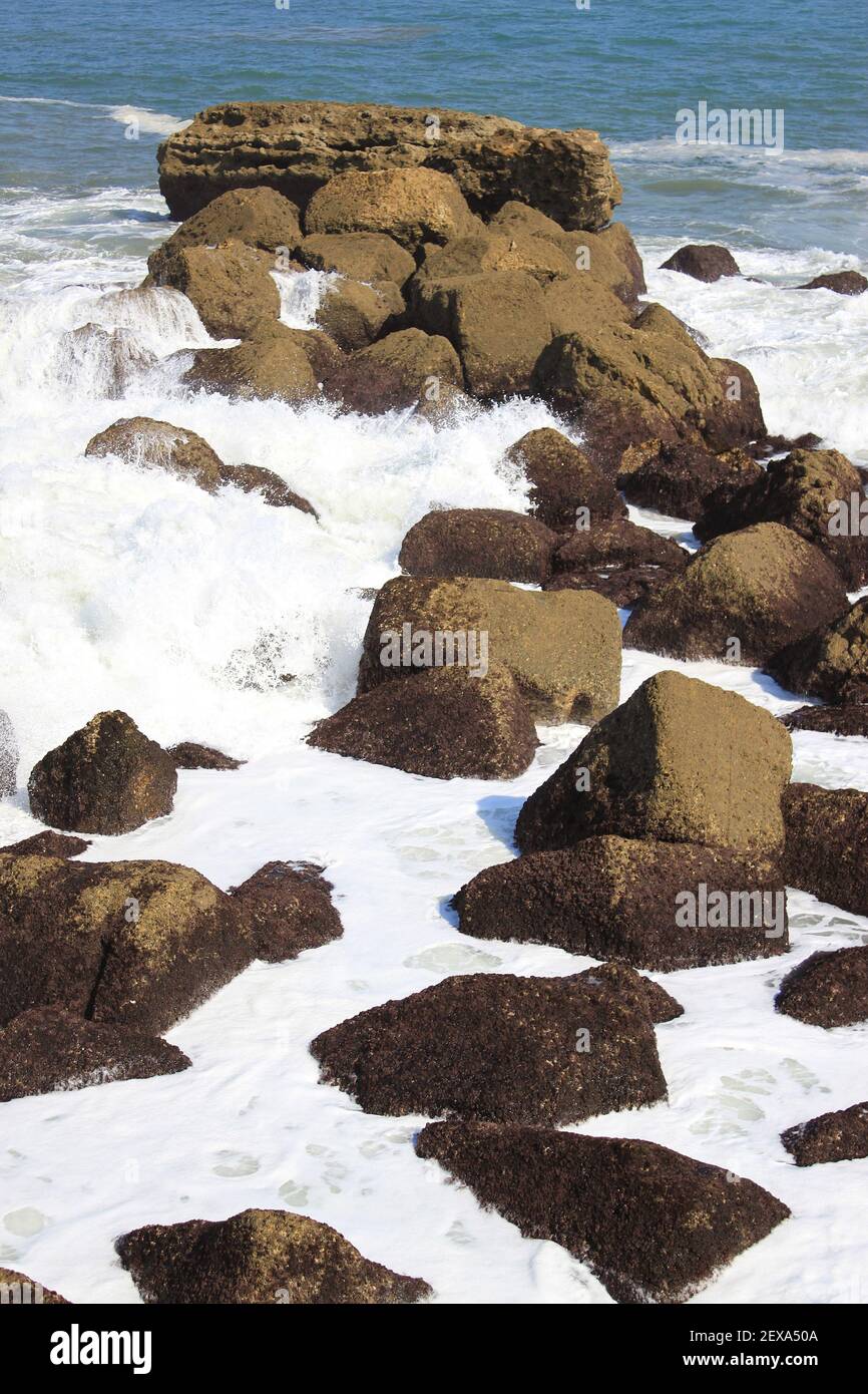 Waves on rocks Stock Photo