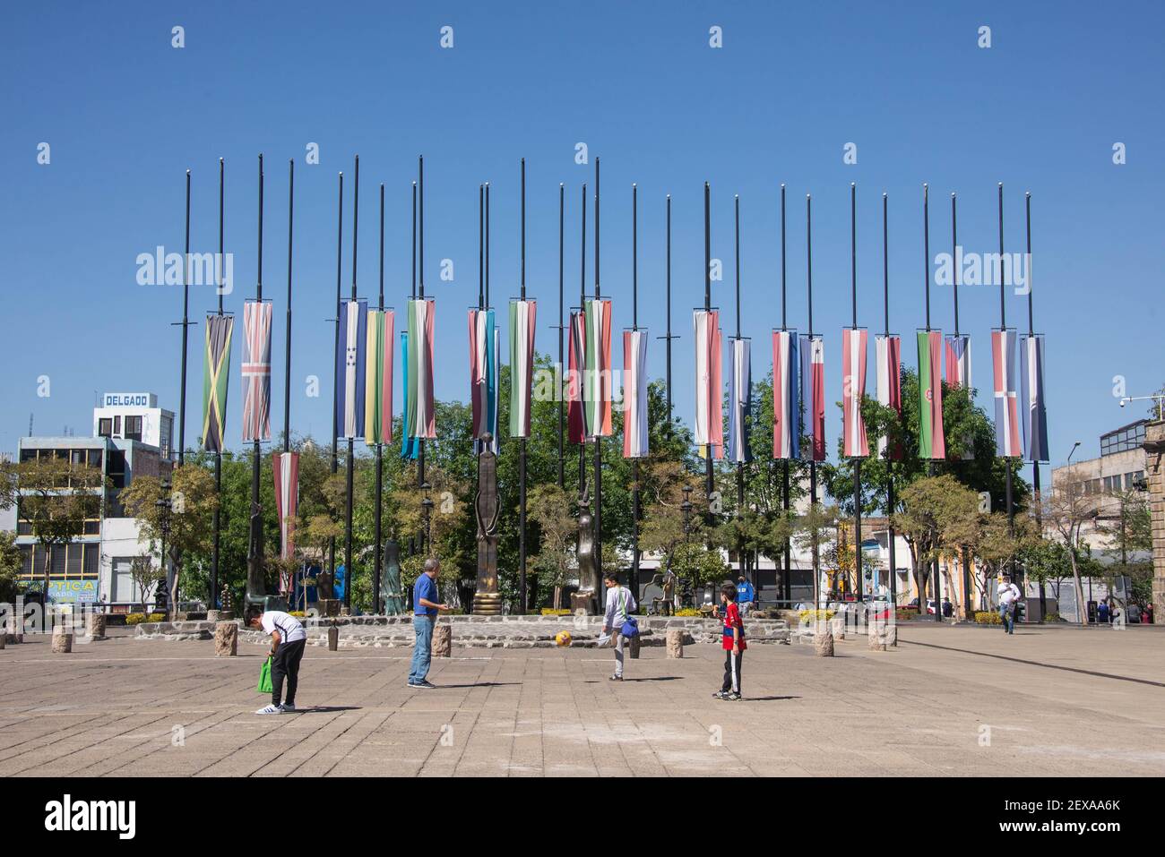 Flags in front of Cultural Institute Museo Cabañas, Guadalajara, Jalisco, Mexico Stock Photo