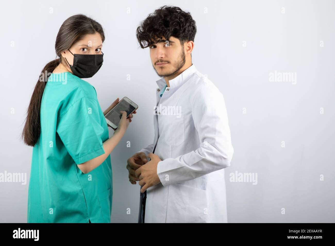 Doctors wearing mask and looking at camera Stock Photo