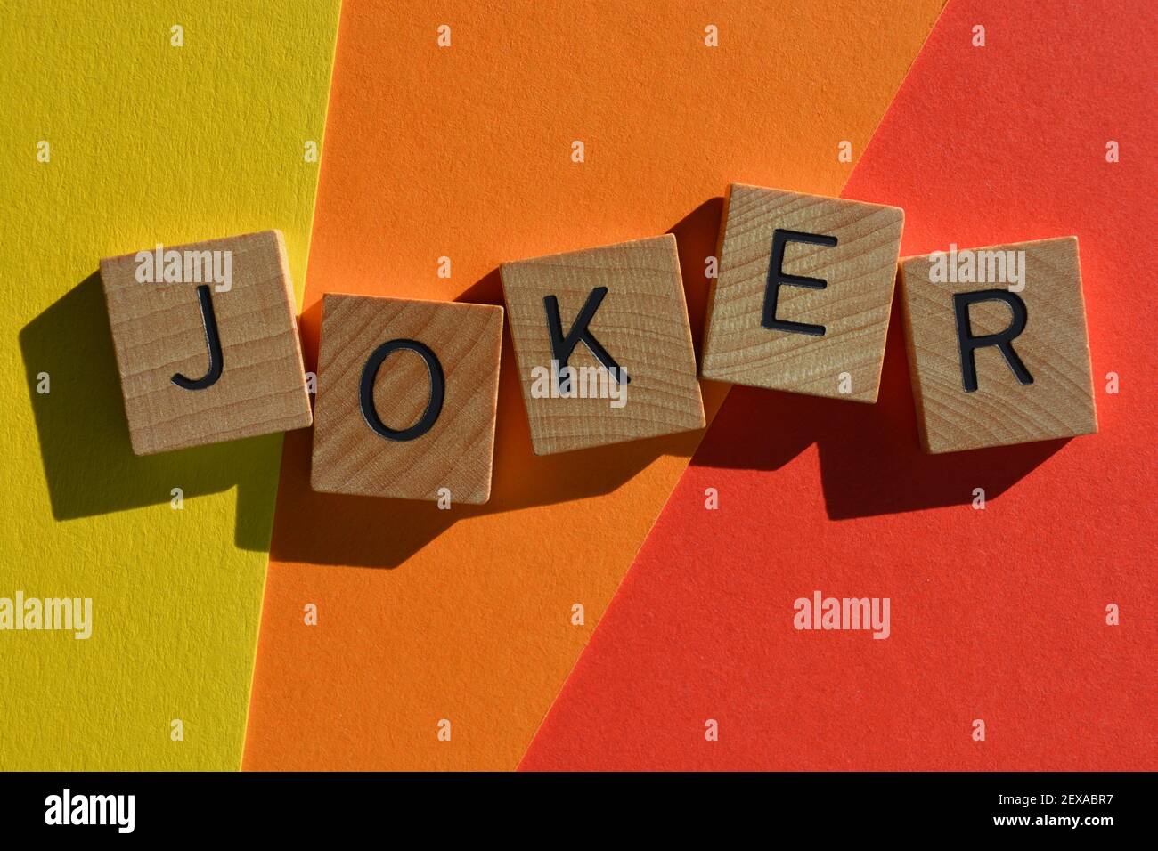 Joker, word in wooden alphabet letters isolated on colourful background Stock Photo