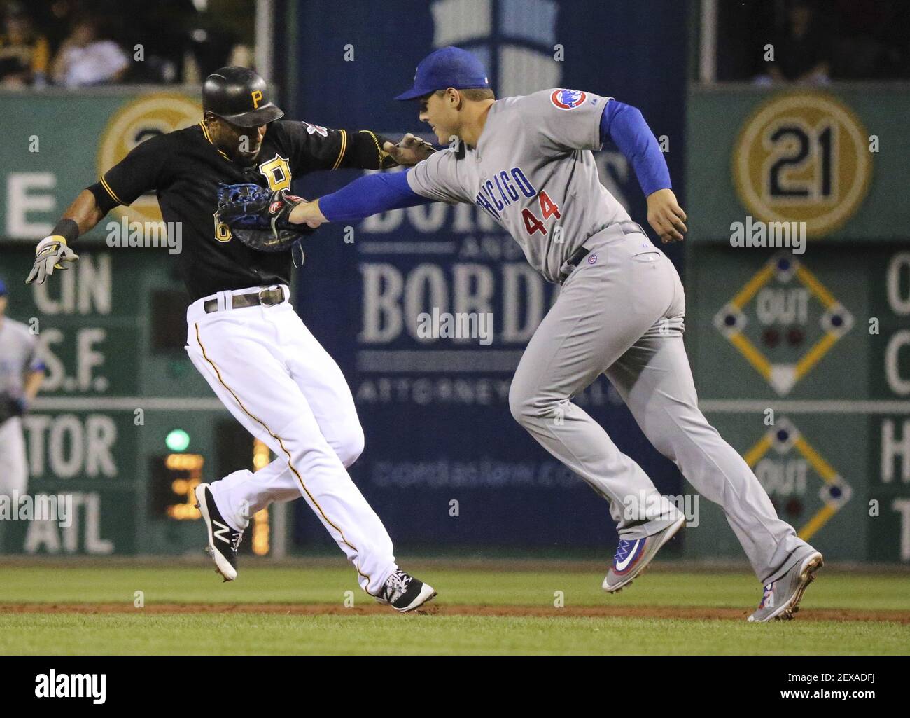 Pittsburgh Pirates' Starling Marte, left, hitches a ride to the