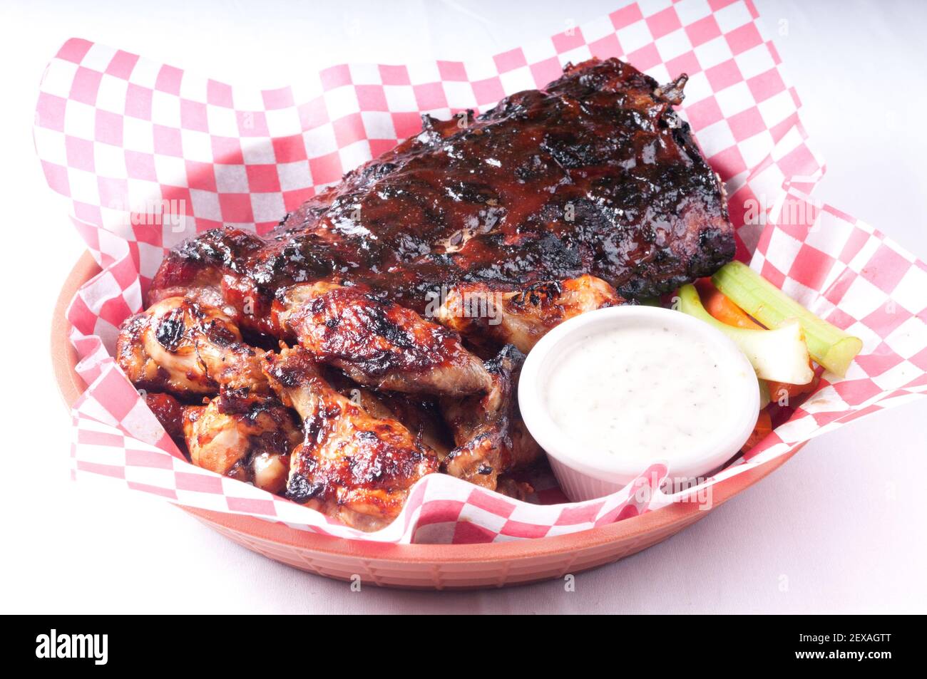 bbq half rack of ribs with a pound of wings Stock Photo Alamy