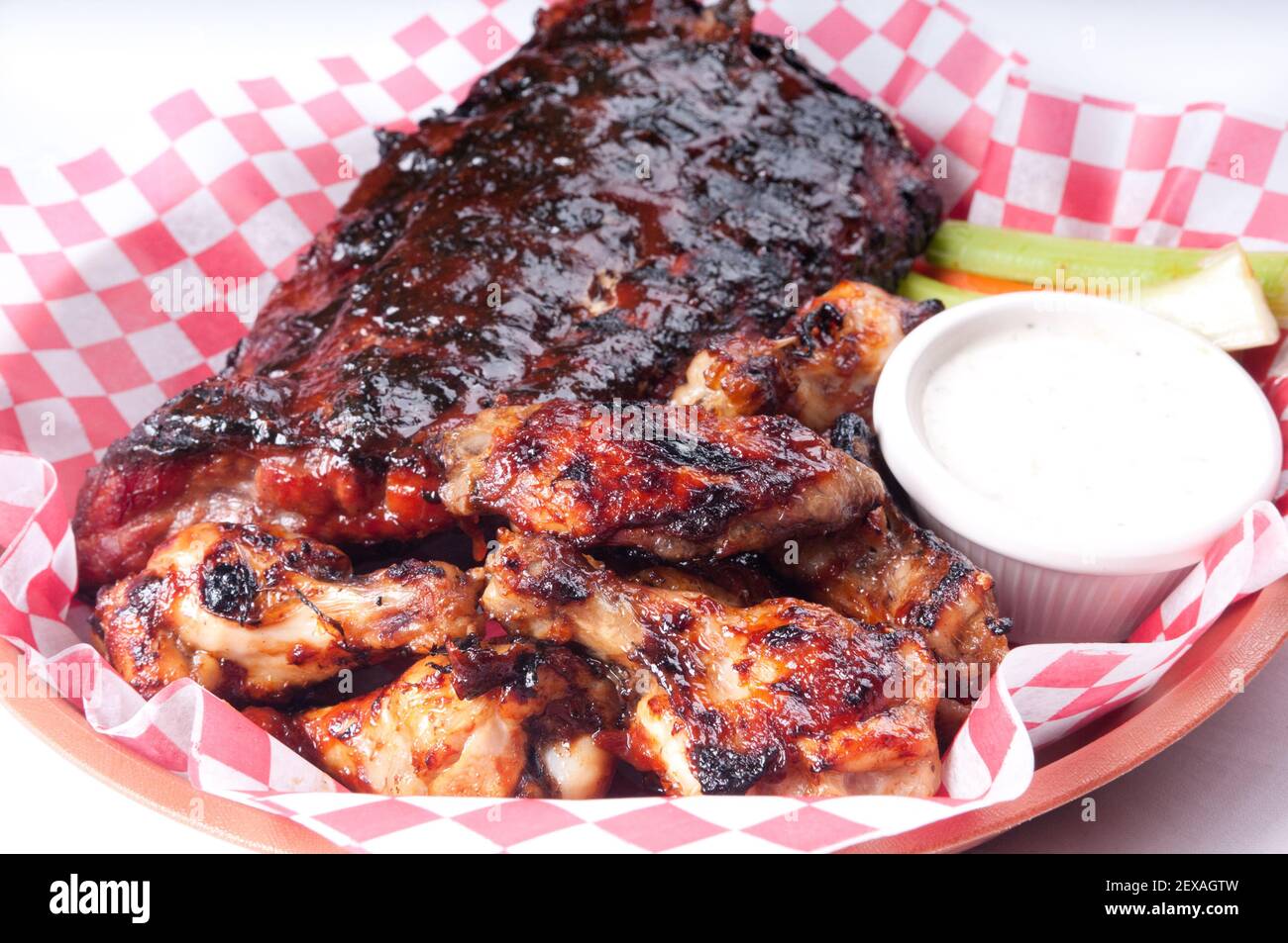 bbq half rack of ribs with a pound of wings Stock Photo Alamy