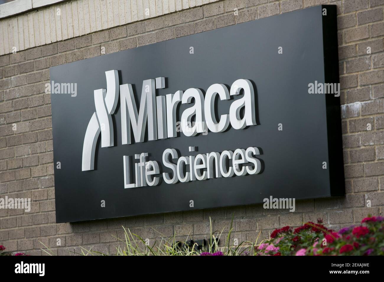 A logo sign outside of the headquarters of Miraca Life Sciences in ...