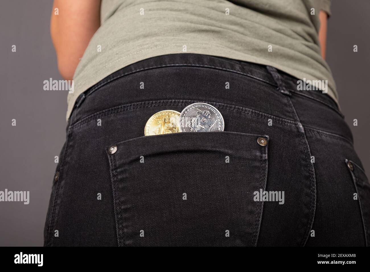 cryptocurrency bitcoin coins in female back pocket Stock Photo - Alamy