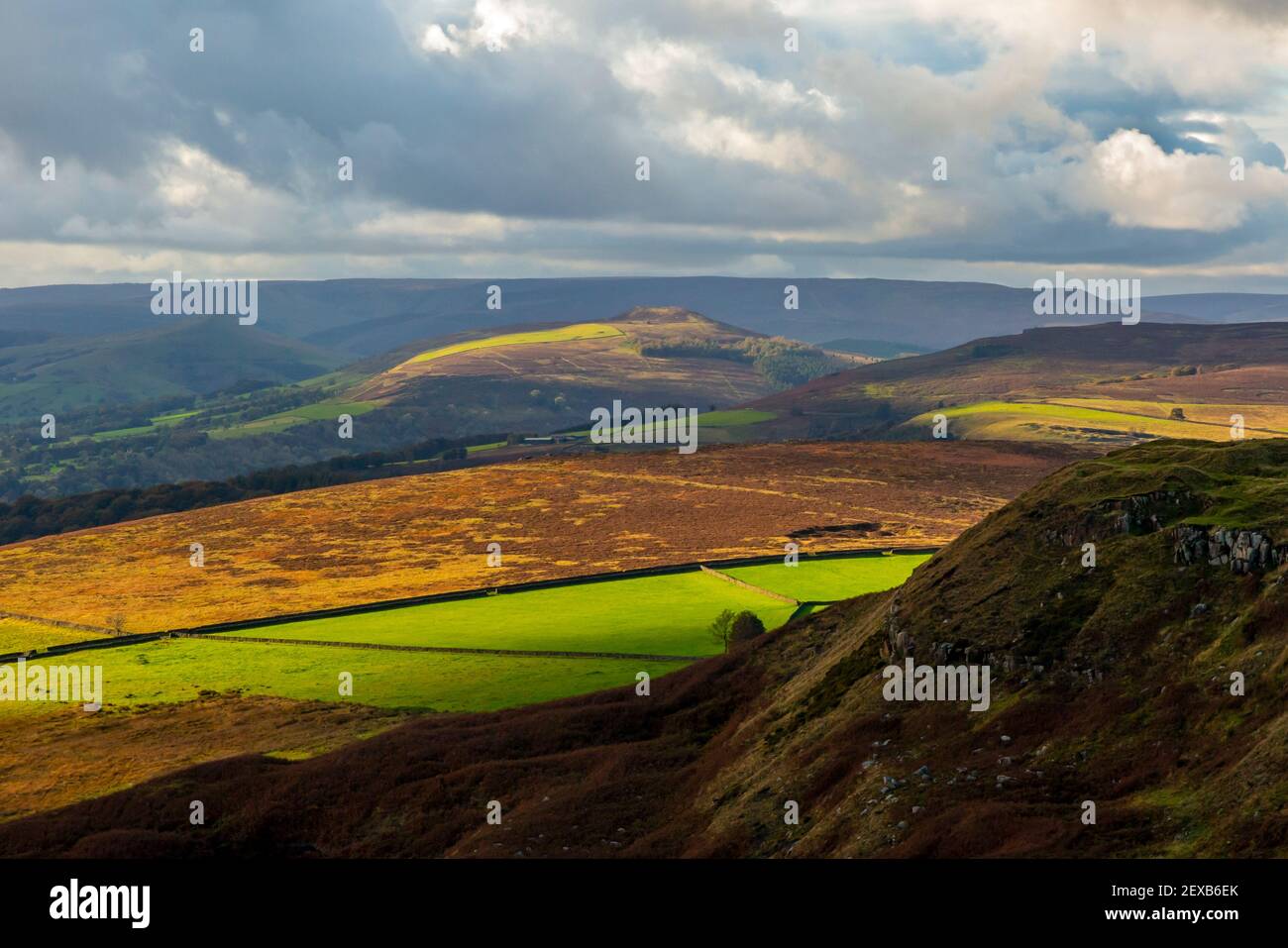 View looking down on the Peak District National Park from Hathersage Moor Derbyshire England UK with stormy sky above. Stock Photo