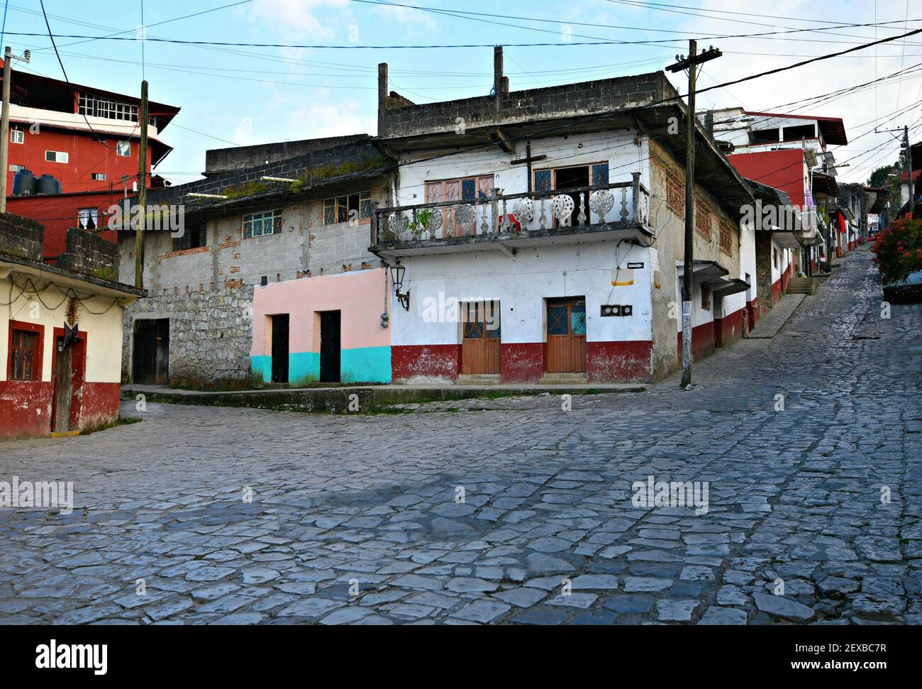 Old traditional houses with stucco walls, clay tile rooftops and