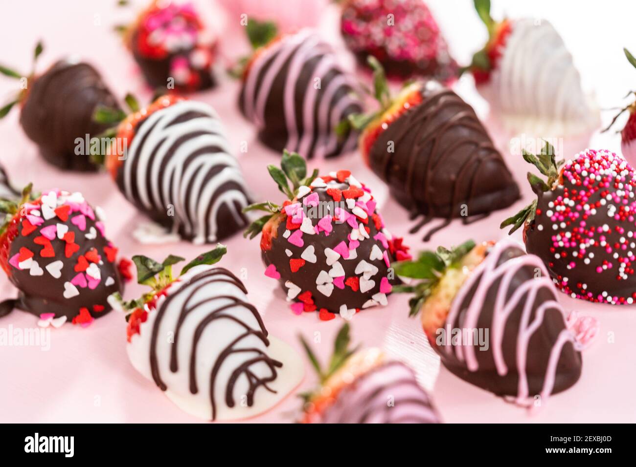 Variety of chocolate dipped strawberries on a pink background Stock ...