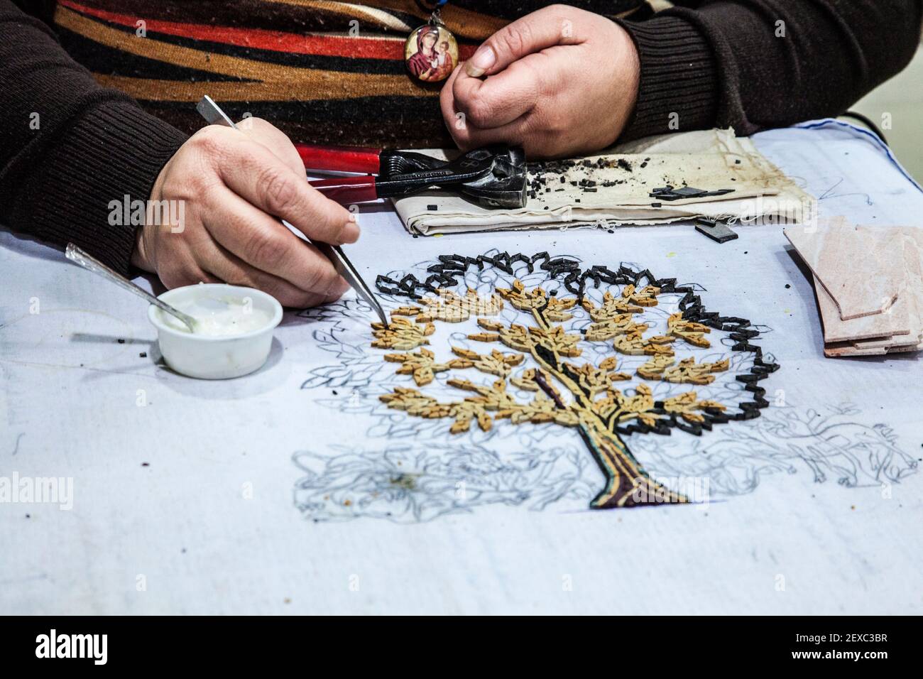 A woman making mosaics in Madaba, Jordan. Stock Photo