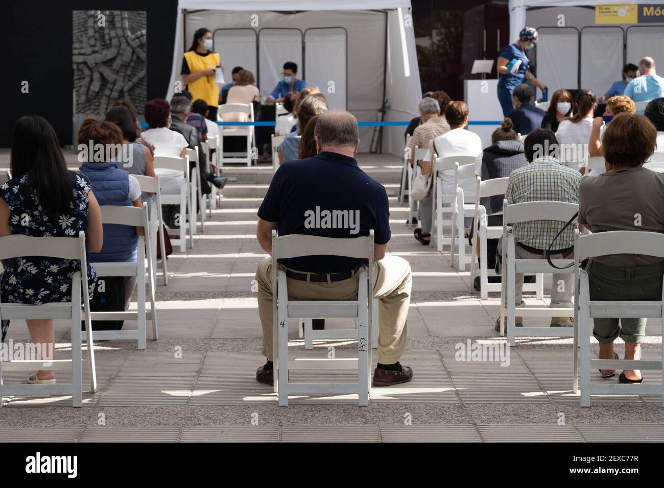 Santiago, Metropolitana, Chile. 4th Mar, 2021. A group of people wait to receive their first or second dose of the Sinovac vaccine against the coronavirus depending on the vaccination schedule, at a vaccination center in Santiago. Credit: Matias Basualdo/ZUMA Wire/Alamy Live News Stock Photo