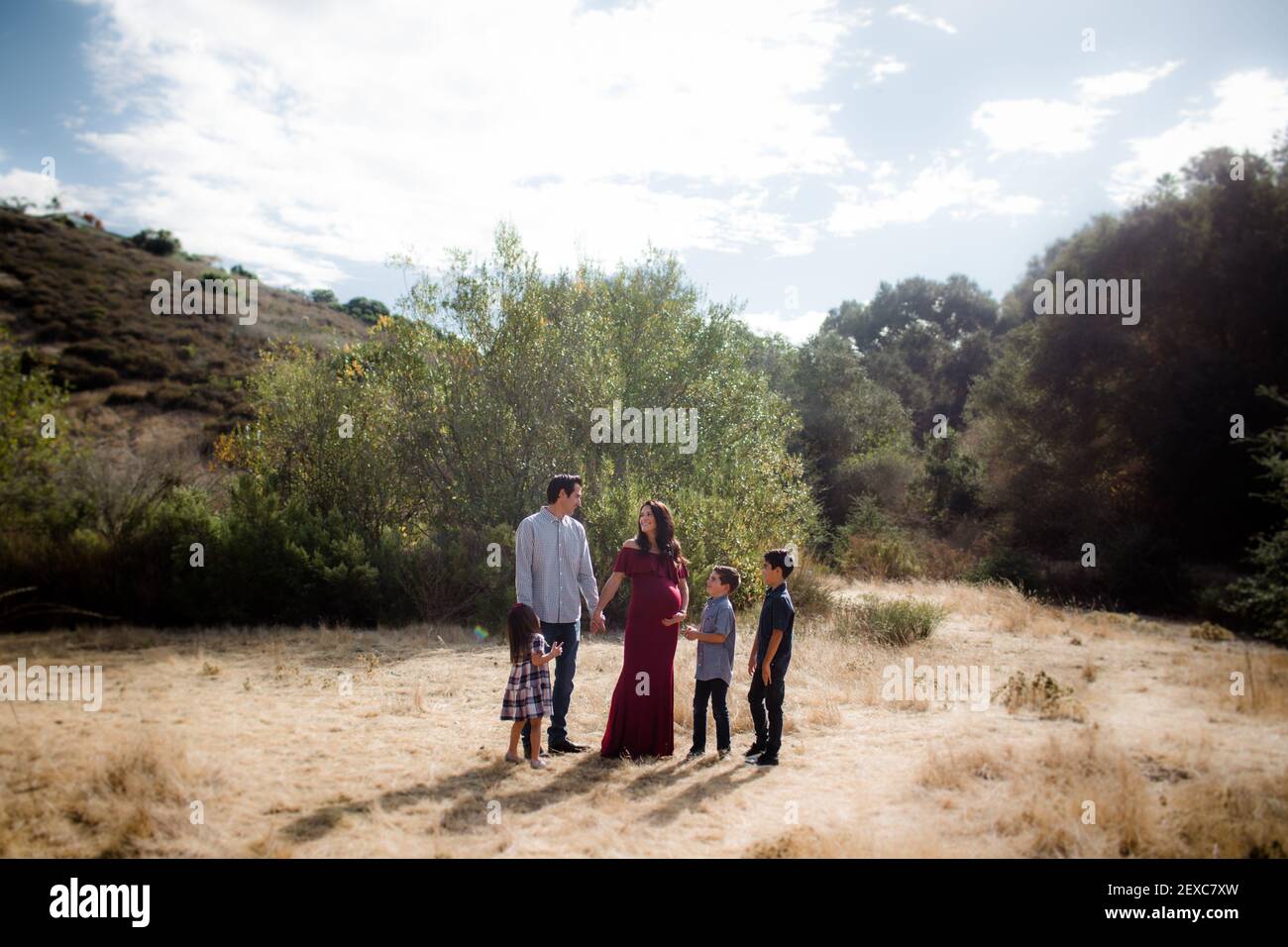 Family of Five Standing in Field in San Diego Stock Photo