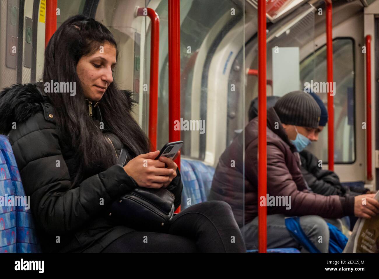 London, UK. 04th Mar, 2021. Most travellers wear masks, as they are mandatory, but plenty do not, for reasons oly known to themselves - The underground is still fairly busy despite the new national Lockdown, Stay at Home, instructions. Credit: Guy Bell/Alamy Live News Stock Photo