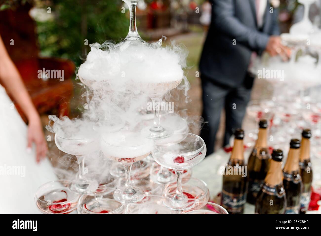 Pyramid of cocktails with champagne and cherries in liquid nitrogen