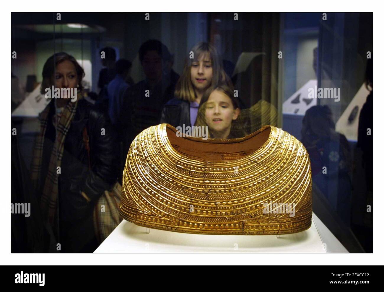 Members of the public get the first sight of the newly restored Mold Gold Cape, dating to early Bronze Age (1900-1600BC) wich goes on display for the first time at the British Museum...The magnificent Mold cape was found around the bones of a skeleton in Flintshire, Wales in 1833.pic David Sandison 27/3/2002 Stock Photo