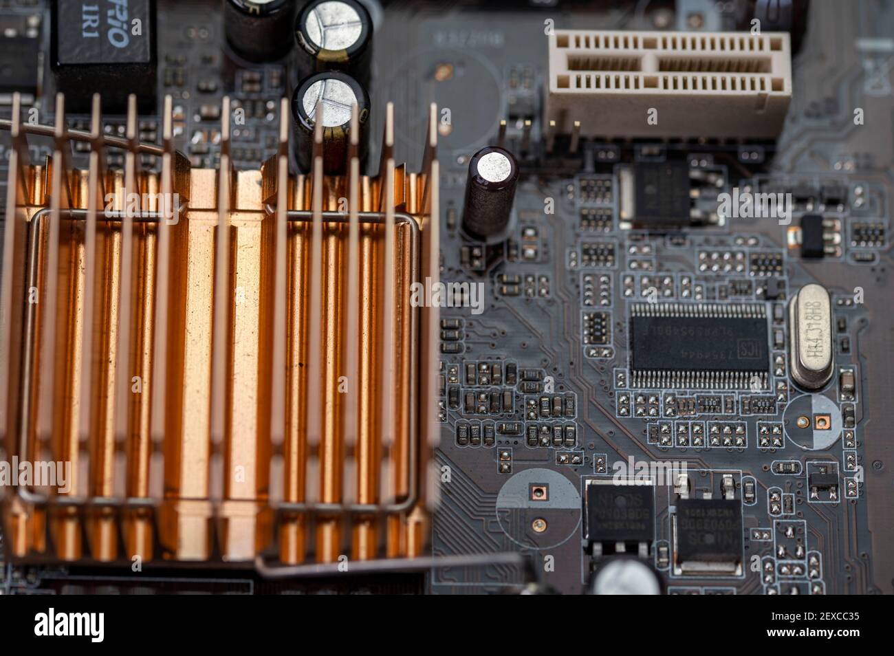 detail of a motherboard with connectors and heatsinks Stock Photo