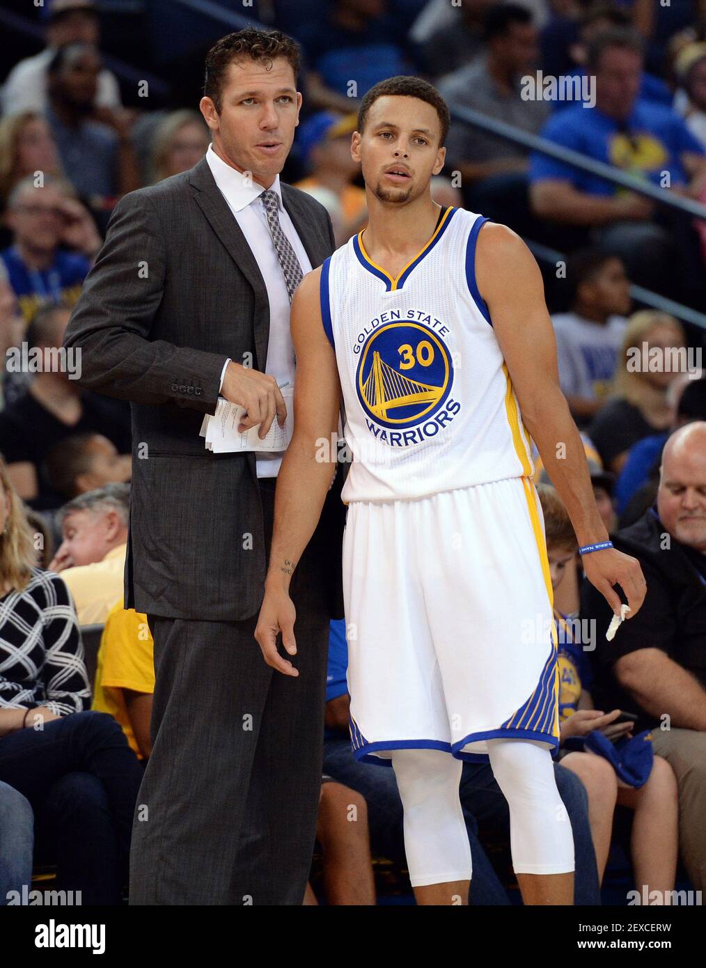 The Golden State Warriors' Stephen Curry (30) confers with interim