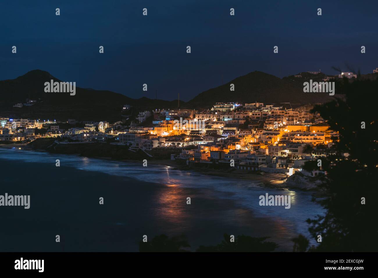 night landscape, waterfront house, waves, from above, long exposure Stock Photo