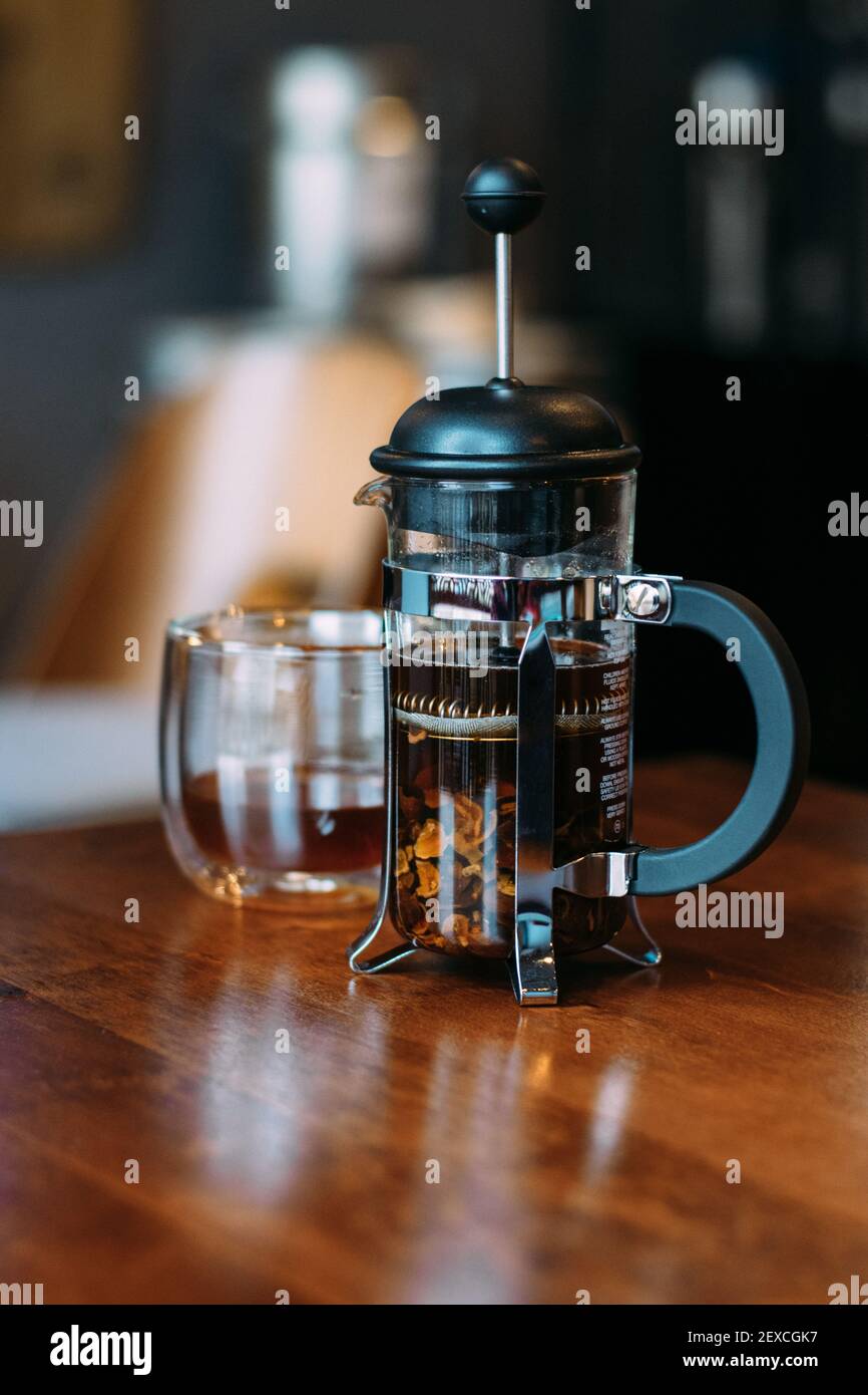 French press and glass with cascara Stock Photo Alamy