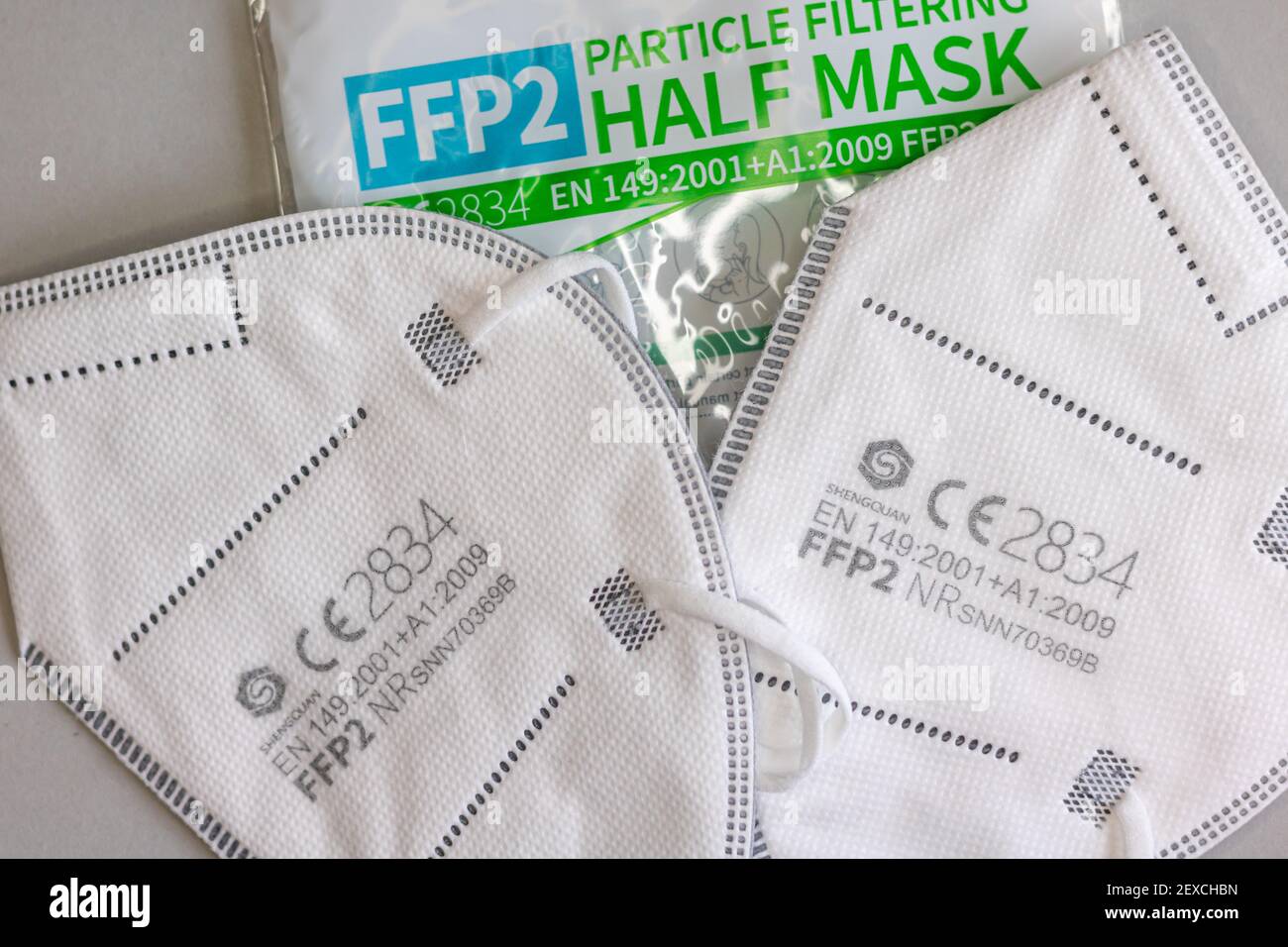 Neckargemund, Germany: March 4, 2021: Two FFP-2 masks and packaging for protection against aerosols e.g. against corona viruses with CE test seal on g Stock Photo
