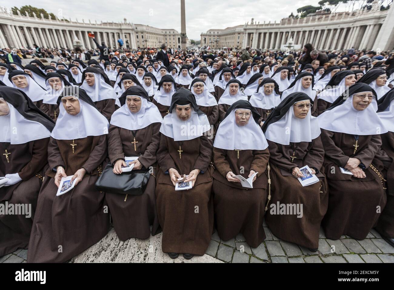 Nuns wait for the arrival of Pope Francis for the canonization of four
