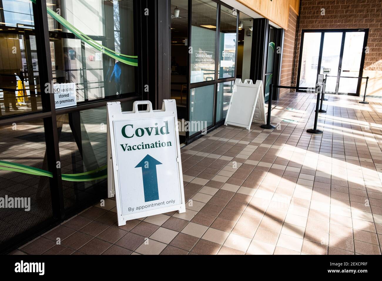 People entering COVID vaccination site run by the state of Vermont Health Department, in former J.C. Penny store in the Berlin Mall, Berlin, VT, USA. Stock Photo